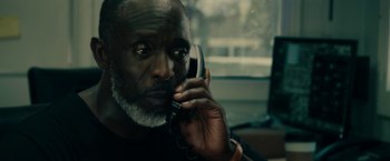 An older man talking on a cell phone