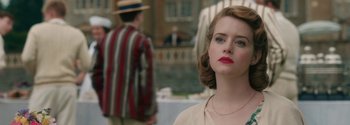 Movie still from “Breathe” (2017), directed by Andy Serkis – A woman with red lipstick looking at the camera; Close Up shot, Over the shoulder angle
