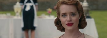 Movie still from “Breathe” (2017), directed by Andy Serkis – A person wearing a dress; Close Up shot, Over the shoulder angle