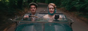 Movie still from “Breathe” (2017), directed by Andy Serkis – A man and a woman in the back of a car; Medium shot, Low angle