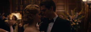 Movie still from “Breathe” (2017), directed by Andy Serkis – A man and a woman in formal wear dancing together; Close Up shot, Low angle