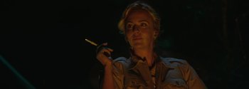 Movie still from “Breathe” (2017), directed by Andy Serkis – A woman holding a lit cigarette in her hand; Close Up shot, Low angle
