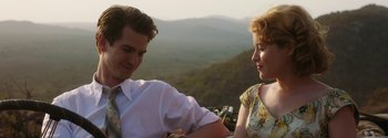 Movie still from “Breathe” (2017), directed by Andy Serkis – A man and a woman sitting next to each other on top of a hill; Medium shot, Over the shoulder angle