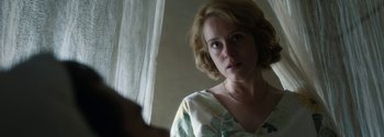 Movie still from “Breathe” (2017), directed by Andy Serkis – A person with short blonde hair; Close Up shot, Over the shoulder angle