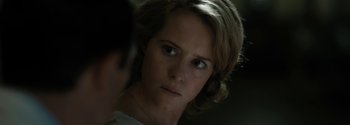 Movie still from “Breathe” (2017), directed by Andy Serkis – A person looking at the camera; Close Up shot, Over the shoulder angle