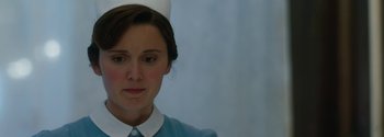 Movie still from “Breathe” (2017), directed by Andy Serkis – A woman wearing a nurse's uniform and a white hat; Close Up shot, Low angle