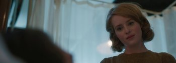 Movie still from “Breathe” (2017), directed by Andy Serkis – A person with short red hair; Close Up shot, Over the shoulder angle