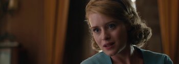 Movie still from “Breathe” (2017), directed by Andy Serkis – A person wearing a blue shirt; Close Up shot, Over the shoulder angle