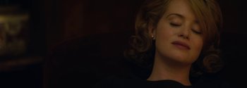 Movie still from “Breathe” (2017), directed by Andy Serkis – A person wearing a black shirt; Close Up shot, High angle