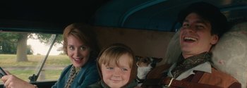 Movie still from “Breathe” (2017), directed by Andy Serkis – A little boy and a woman with a dog in a car; Close Up shot, Over the shoulder angle