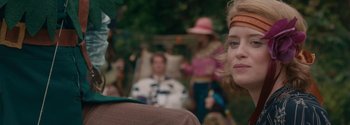 Movie still from “Breathe” (2017), directed by Andy Serkis – A group of people sitting in a room; Close Up shot, Over the shoulder angle