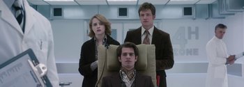 Movie still from “Breathe” (2017), directed by Andy Serkis – A man and two women in suits and ties; Medium shot, Low angle