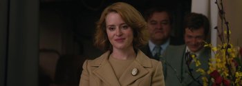 Movie still from “Breathe” (2017), directed by Andy Serkis – A person wearing a suit and tie; Close Up shot, Over the shoulder angle