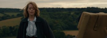 Movie still from “Breathe” (2017), directed by Andy Serkis – A man with long blonde hair wearing a black jacket; Medium shot, Low angle