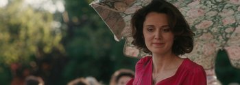 Movie still from “Breathe” (2017), directed by Andy Serkis – A person holding an open umbrella; Close Up shot, Over the shoulder angle