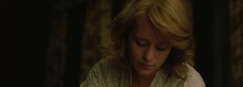 Movie still from “Breathe” (2017), directed by Andy Serkis – A person sitting in a room; Close Up shot, Over the shoulder angle