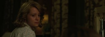 Movie still from “Breathe” (2017), directed by Andy Serkis – A young woman is looking at the camera; Close Up shot, Over the shoulder angle