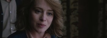 Movie still from “Breathe” (2017), directed by Andy Serkis – A woman's face in a dark room; Close Up shot, Over the shoulder angle