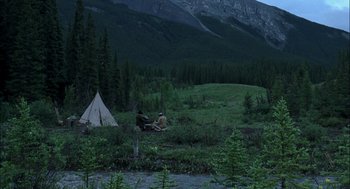 Movie still from “Brokeback Mountain” (2005), directed by Ang Lee – Two people sitting in front of a tent in the wilderness; Extreme Wide shot, High angle