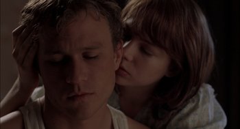 Movie still from “Brokeback Mountain” (2005), directed by Ang Lee – A man and a woman laying on a bed; Close Up shot, Over the shoulder angle