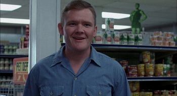 Movie still from “Brokeback Mountain” (2005), directed by Ang Lee – A man standing in front of a shelf in a store; Close Up shot, Low angle