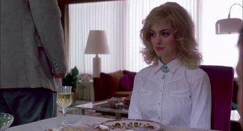 Movie still from “Brokeback Mountain” (2005), directed by Ang Lee – A woman sitting at a table with a glass of wine; Medium shot, Over the shoulder angle