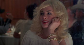 Movie still from “Brokeback Mountain” (2005), directed by Ang Lee – A beautiful blonde woman talking on a cell phone; Close Up shot, Over the shoulder angle