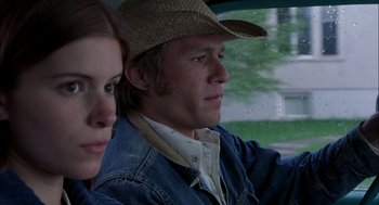 Movie still from “Brokeback Mountain” (2005), directed by Ang Lee – A man and a woman sitting in a car looking out the window; Close Up shot, High angle