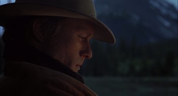 Movie still from “Brokeback Mountain” (2005), directed by Ang Lee – A man wearing a cowboy hat looking to the side; Close Up shot, Low angle