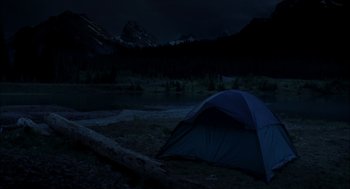 Movie still from “Brokeback Mountain” (2005), directed by Ang Lee – A tent is pitched in the middle of the night; Extreme Wide shot, High angle