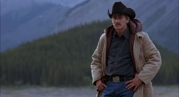 Movie still from “Brokeback Mountain” (2005), directed by Ang Lee – A man wearing a cowboy hat and a jacket; Medium shot, Over the shoulder angle