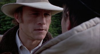 Movie still from “Brokeback Mountain” (2005), directed by Ang Lee – A man wearing a cowboy hat talking to another man; Close Up shot, Over the shoulder angle