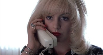Movie still from “Brokeback Mountain” (2005), directed by Ang Lee – A woman holding a phone up to her ear; Close Up shot, Low angle
