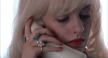Movie still from “Brokeback Mountain” (2005), directed by Ang Lee – A person talking on a phone; Extreme Close Up shot, High angle