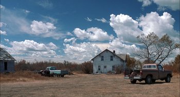 Movie still from “Brokeback Mountain” (2005), directed by Ang Lee – An old truck parked in front of an abandoned house; Extreme Wide shot, Low angle