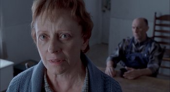 Movie still from “Brokeback Mountain” (2005), directed by Ang Lee – An older woman is looking at the camera; Close Up shot, Over the shoulder angle