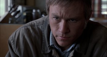Movie still from “Brokeback Mountain” (2005), directed by Ang Lee – A man's face as he stares into the camera; Close Up shot, Low angle