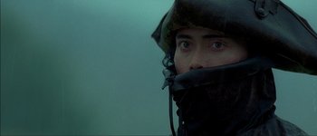 Movie still from “Brotherhood of the Wolf” (2001), directed by Christophe Gans – A man with a helmet and a mask on his face; Close Up shot, Low angle