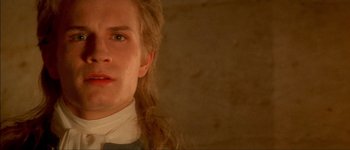 Movie still from “Brotherhood of the Wolf” (2001), directed by Christophe Gans – A man with long blonde hair wearing a white shirt; Close Up shot, Low angle