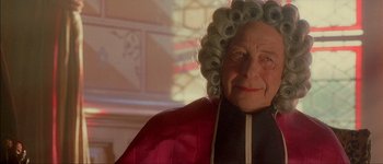 Movie still from “Brotherhood of the Wolf” (2001), directed by Christophe Gans – An old woman with a long curly hair and a wig; Close Up shot, Over the shoulder angle