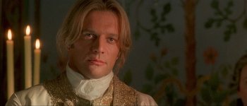 Movie still from “Brotherhood of the Wolf” (2001), directed by Christophe Gans – A person with long blonde hair; Close Up shot, Over the shoulder angle