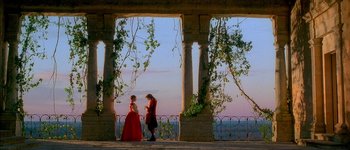 Movie still from “Brotherhood of the Wolf” (2001), directed by Christophe Gans – A man and a woman standing next to each other on a balcony; Extreme Wide shot, Low angle