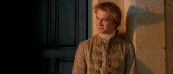 Movie still from “Brotherhood of the Wolf” (2001), directed by Christophe Gans – A young man in a renaissance outfit looking to his left; Close Up shot, Over the shoulder angle