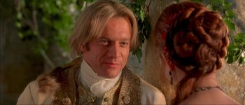 Movie still from “Brotherhood of the Wolf” (2001), directed by Christophe Gans – A person with long hair; Close Up shot, Over the shoulder angle