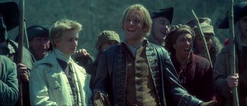 Movie still from “Brotherhood of the Wolf” (2001), directed by Christophe Gans – A group of people standing next to each other; Medium shot, Low angle