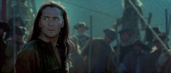 Movie still from “Brotherhood of the Wolf” (2001), directed by Christophe Gans – A person with long hair; Close Up shot, Over the shoulder angle