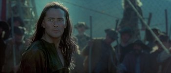 Movie still from “Brotherhood of the Wolf” (2001), directed by Christophe Gans – A person with long hair; Close Up shot, Over the shoulder angle