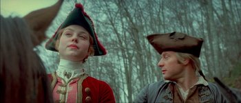 Movie still from “Brotherhood of the Wolf” (2001), directed by Christophe Gans – A man and a woman dressed in period costumes; Close Up shot, Low angle