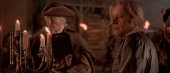 Movie still from “Brotherhood of the Wolf” (2001), directed by Christophe Gans – Two men in old - fashioned clothing standing next to each other; Close Up shot, Over the shoulder angle