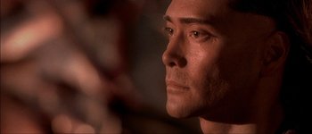 Movie still from “Brotherhood of the Wolf” (2001), directed by Christophe Gans – A man's face in a dimly - lit room; Close Up shot, Low angle